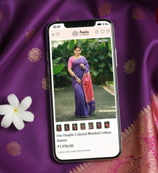 A mobile interface highlighting Aada’s saree collection, framed with rich fabric backdrops, showcasing accessibility, elegance, and optimized mobile shopping experience.