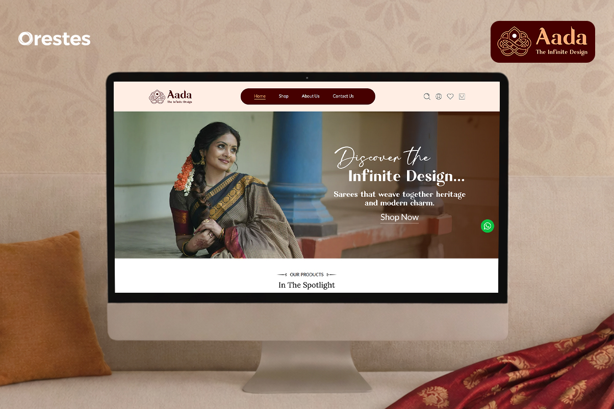 A desktop view of Aada’s homepage featuring a graceful saree model, rich cultural visuals, and a hero banner that blends traditional craftsmanship with modern digital aesthetics.