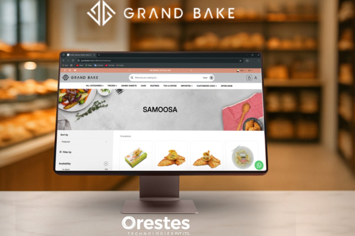 A desktop monitor mockup showcasing the "Samoosa" collection page of the Grand Bake e-commerce website, set against a blurred bakery storefront background with the Orestes Technologies Pvt. Ltd. logo at the bottom.