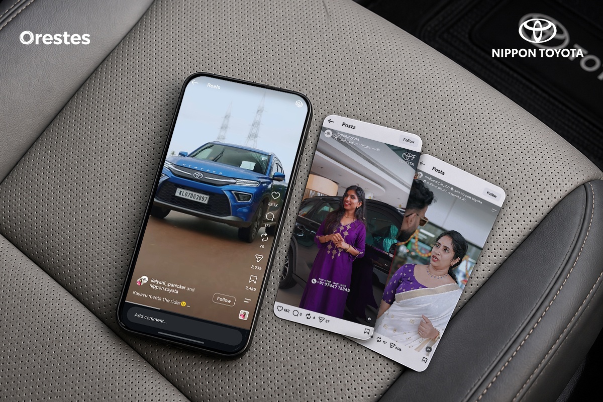 Nippon Toyota social media posts displayed on smartphones placed on a luxury Toyota car seat