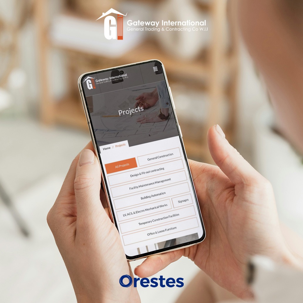 Close-up of hands holding a smartphone displaying a mobile-responsive "Projects" filter menu for a construction company website.