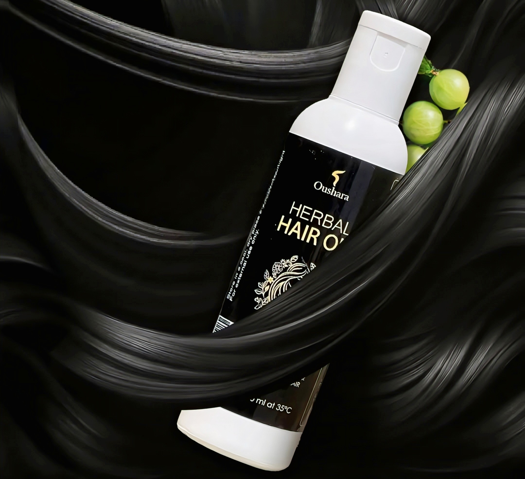 A bottle of Oushara Herbal Hair Oil artfully integrated into a background of smooth, flowing black hair and green Amla berries, symbolizing hair strength and luster.