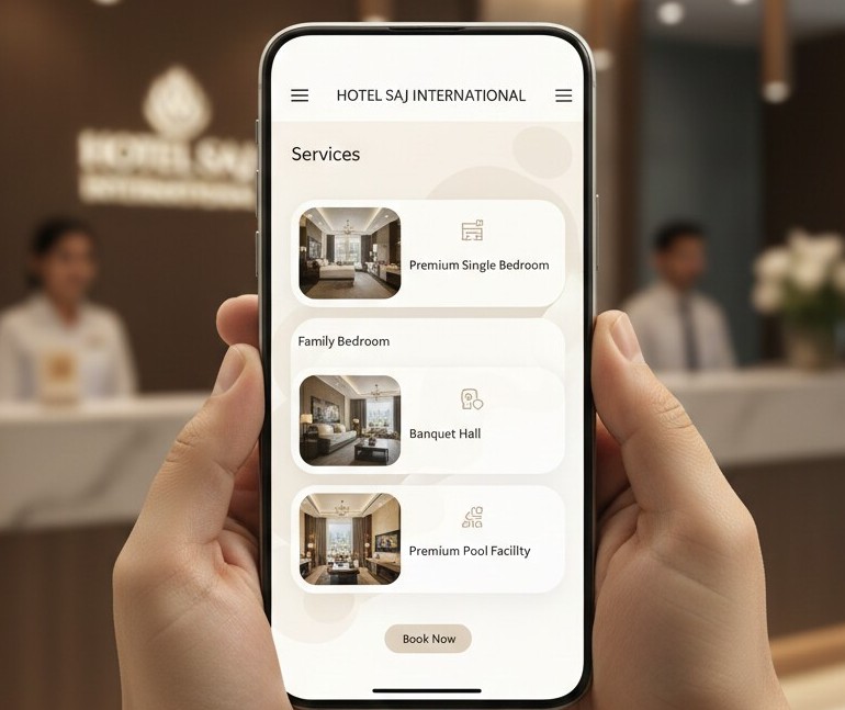 Mobile view of Hotel Saj International website showing services like premium rooms, banquet hall, and pool facility, displayed in front of a hotel reception area.