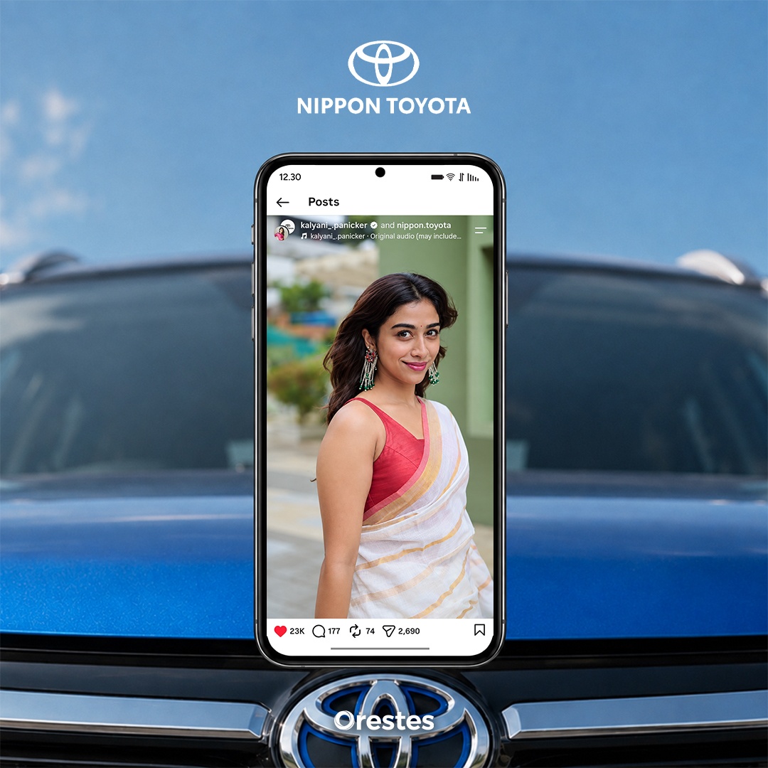 Smartphone displaying a Nippon Toyota social media post featuring a woman in traditional Kerala attire